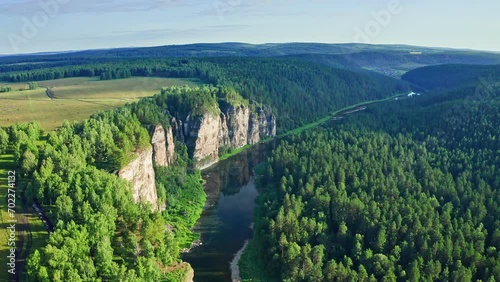 Aiskie pritesi rocks. Aerial view of river Ai and famous rocky cliffs in green forest at Ural mountains photo