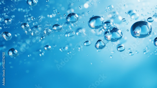 close-up of water waves and bubbles on a blue background.