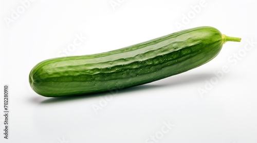 A solitary cucumber isolated against a white background, its smooth skin and vibrant green color displayed in high definition.