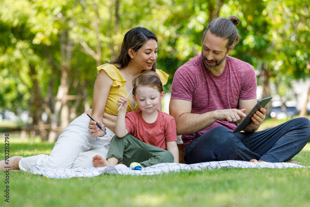 Fototapeta premium Happy family day, father, mother, son, Caucasian enjoying watercolor painting and picnic in nature.