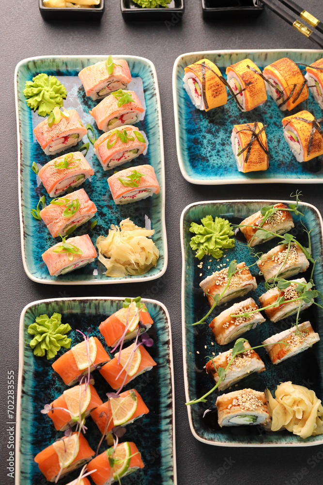 Assorted sushi nigiri and maki big set on slate. A variety of Japanese sushi with tuna, crab, salmon, eel and rolls. Top view