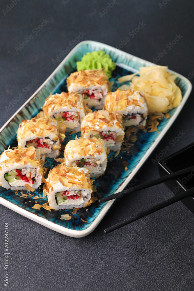 Assorted sushi nigiri and maki big set on slate. A variety of Japanese sushi with tuna, crab, salmon, eel and rolls. Top view Assorted sushi nigiri and maki big set on slate. A variety of Japanese sushi with tuna, crab, salmon, eel and rolls. Top view