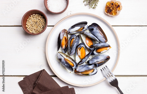 Cooked mussels in white cream sauce. Seafood. Healthy eating. Diet.