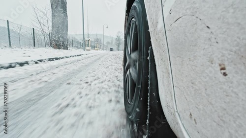 Car Front Winter Tyre Close Up Driving Through Slushy Mud Snow Covered Icy Road