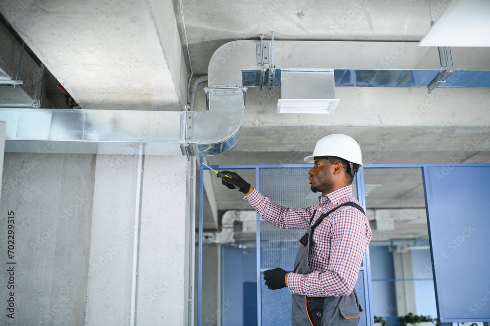 ventilation system installation and repair service. hvac technician at work. banner copy space ventilation system installation and repair service. hvac technician at work. banner copy space