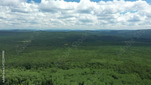 Endless landscape with green woods and sky with clouds. Aerial view photo