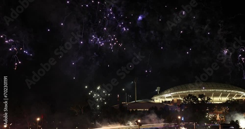 Adelaide sees in the new year with an amazing fireworks display over the River Torrens with the Adelaide Oval in the background photo