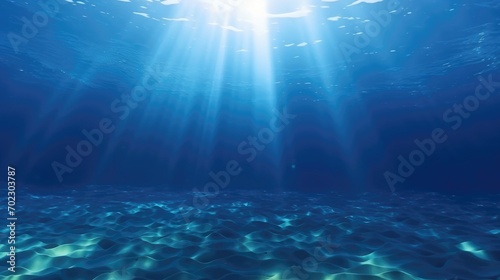 Deep ocean, blue underwater with sunlight shine to sand sea floor photo