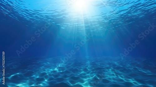 Deep ocean, blue underwater with sunlight shine to sand sea floor © Eyepain