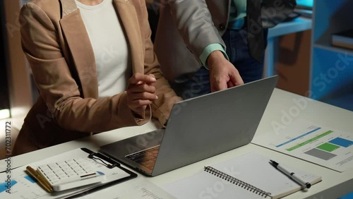The sales department is having a monthly summary meeting to bring it to the department manager, they are verifying the correctness of the documents that are prepared before bringing in to the manager