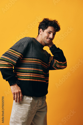 Style man happy smile yellow fashion background orange student portrait trendy sweater stylish