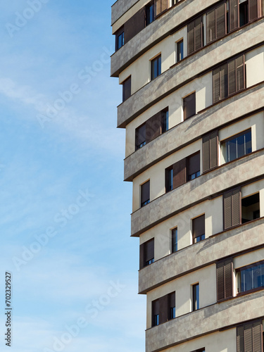 Tall housing blocks with a large number of windows and terraces. Singular buildings.