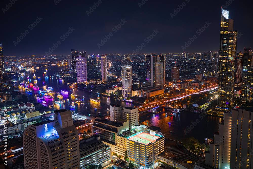 Beautiful cityscape Bangkok river boat business district and residential. In the twilight,