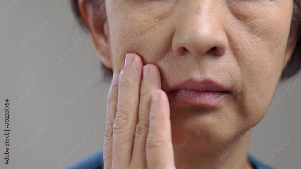 Flabby and wrinkled skin on senior woman face.