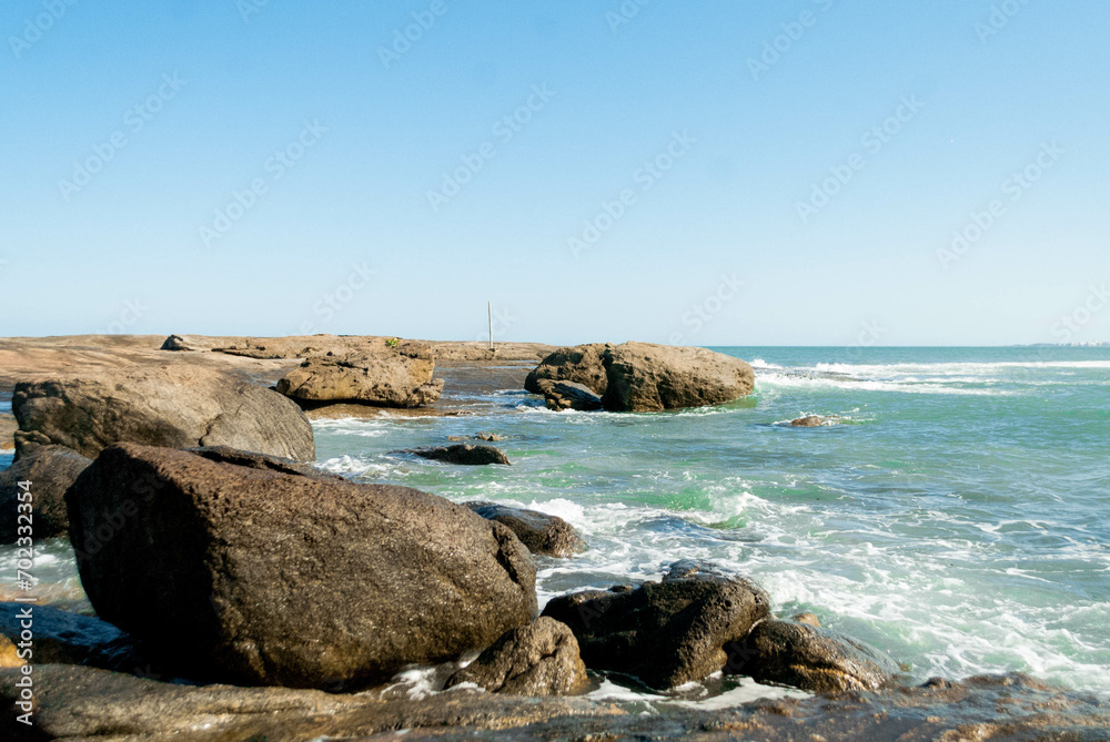 Sea with rocks and blue sky