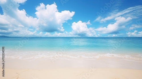 Background of tropical beach and blue sea and blurred sky, white clouds with sunlight angel. © venusvi