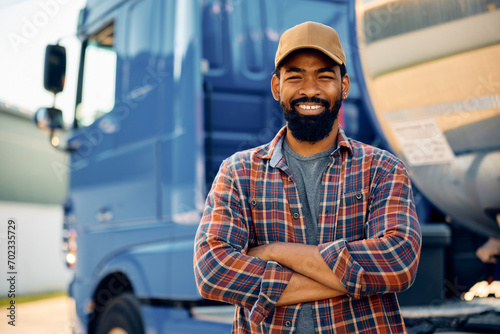 Confident black truck driver looking at camera. photo