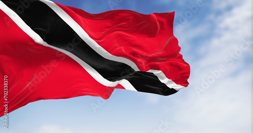 Trinidad and Tobago national flag waving on a clear day photo