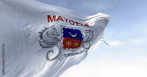 Flag of Mayotte waving in the wind on a clear day photo