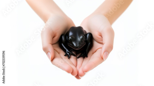 Cute black frog in hand. Special animals concept. AI generated.