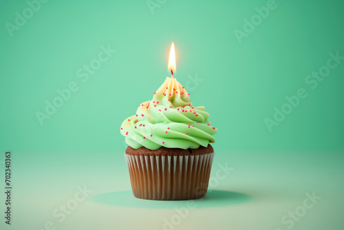 cupcake green cream with festive, burning candle, sprinkling, isolated, background
