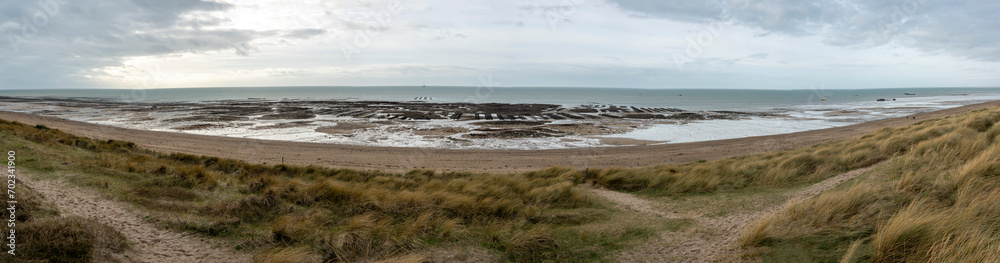 Gouville, France - 12 30 2023: Panoramic view the dunes, the beach, the sea, the oyster park and the Senequet lighthouse.