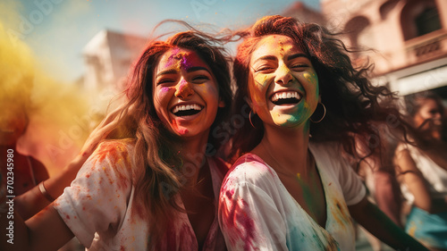 Group of friends having fun at the festival of colors Holi.