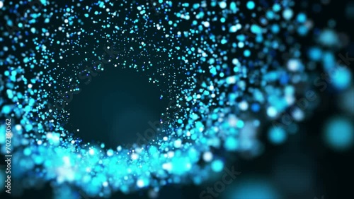 Blue circles of particle waves diverging from center. Colorful glowing brilliant swirl. Looped abstract animation. photo