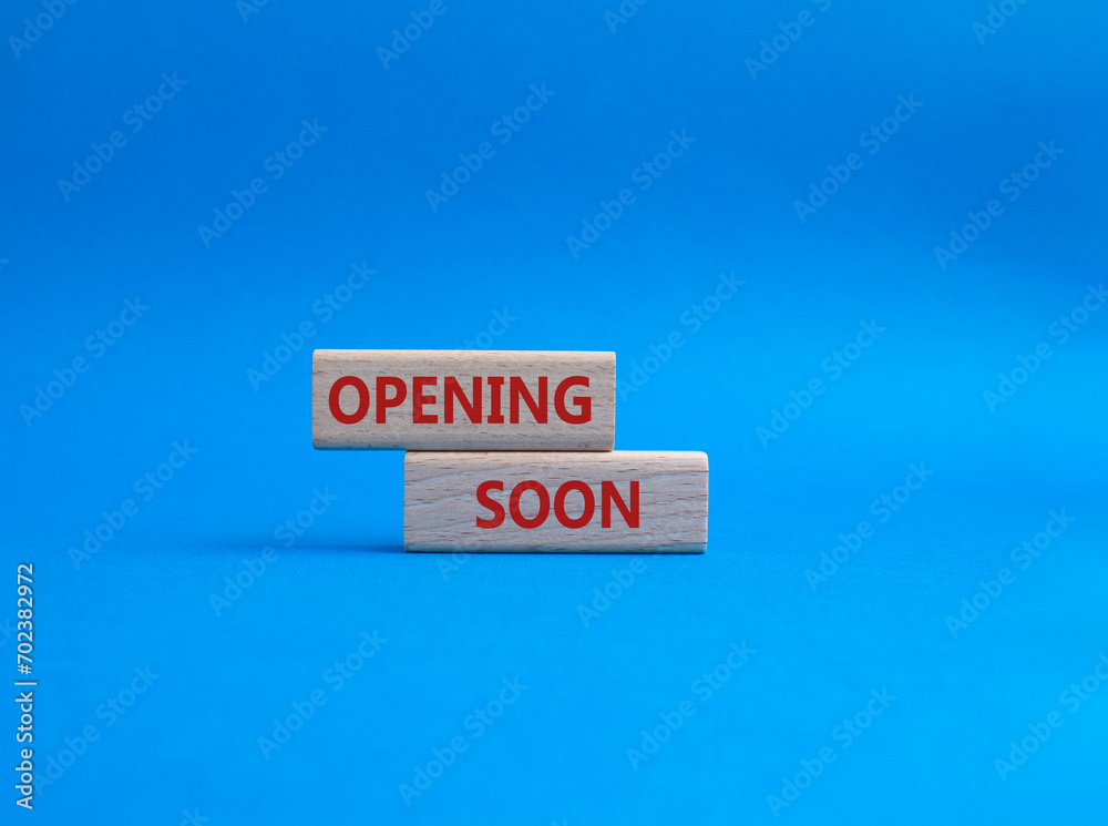 Opening soon symbol. Concept word Opening soon on wooden blocks. Beautiful blue background. Business and Opening soon concept. Copy space Opening soon symbol. Concept word Opening soon on wooden blocks. Beautiful blue background. Business and Opening soon concept. Copy space