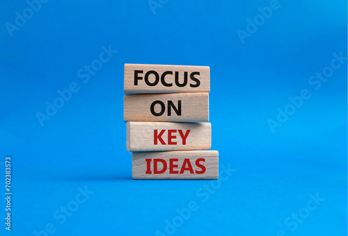 Focus on Key Ideas symbol. Concept words Focus on Key Ideas on wooden blocks. Beautiful blue background. Business and Focus on Key Ideas concept. Copy space