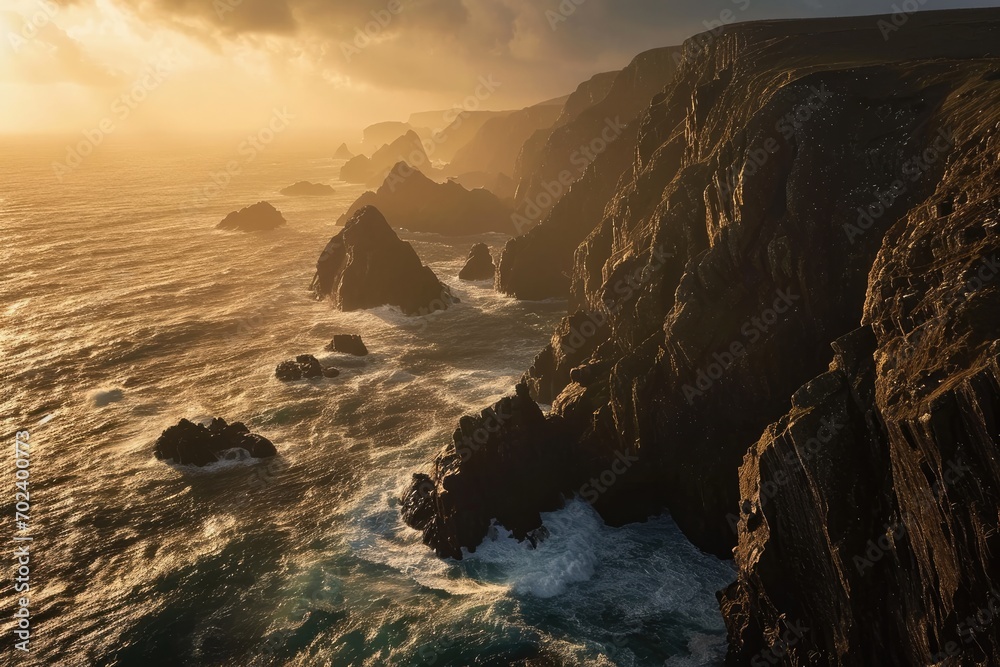 A breathtaking sunset illuminates the rugged cliffs and crashing waves of a majestic headland, showcasing the beauty and power of nature's elements