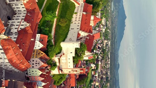 Aerial view over the medieval town Fussen, river and countryside and mountain, Germany. Aerial vertical, vertical video background. photo