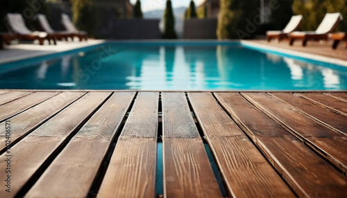 Deserted wooden terrace with a pool photo