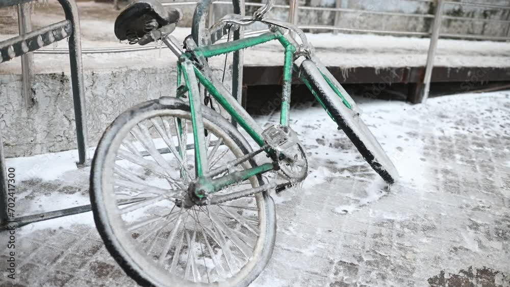 green retro bike in ice on a background of snow in winter in a severe frost. green retro bike in ice on a background of snow in winter in a severe frost.