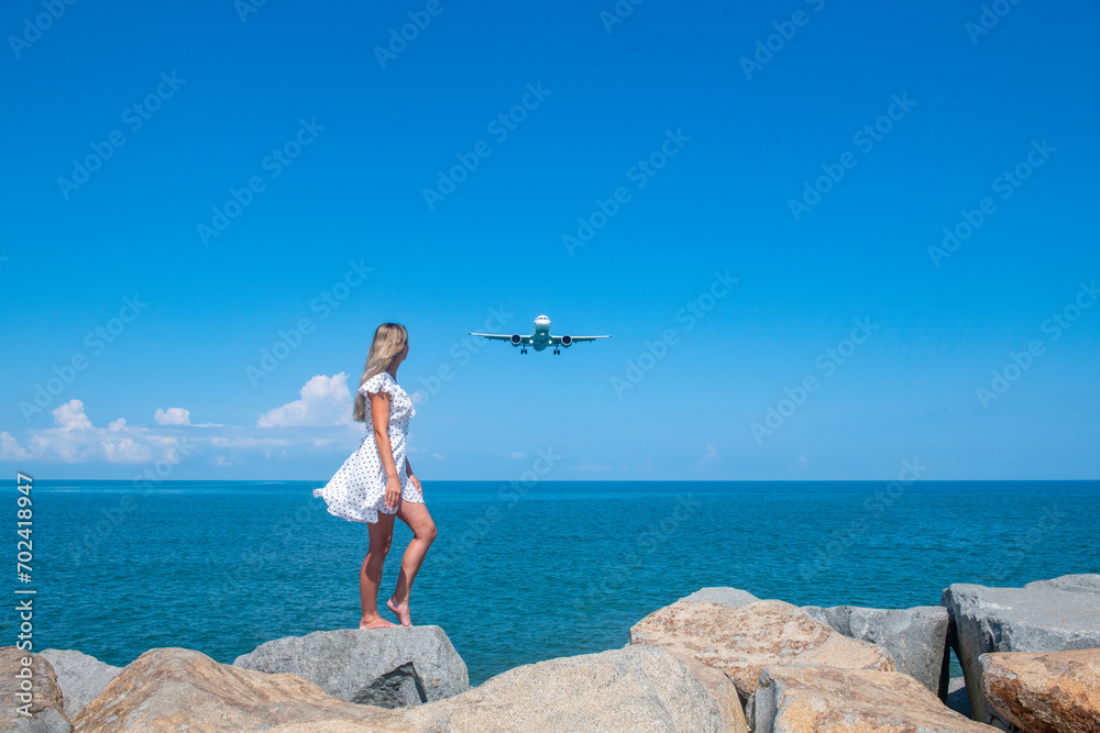 Airborne Encounters: Girl in White Dress on Stones, Plane Over the Blue Sea Airborne Encounters: Girl in White Dress on Stones, Plane Over the Blue Sea