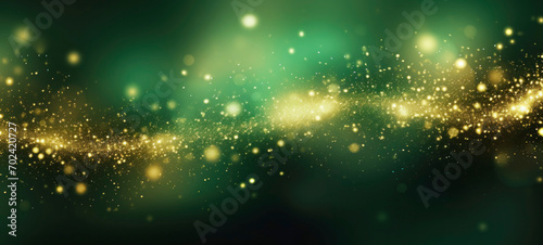 Waves of golden sparkles, shiny glitter bokeh lights on green background © spyrakot