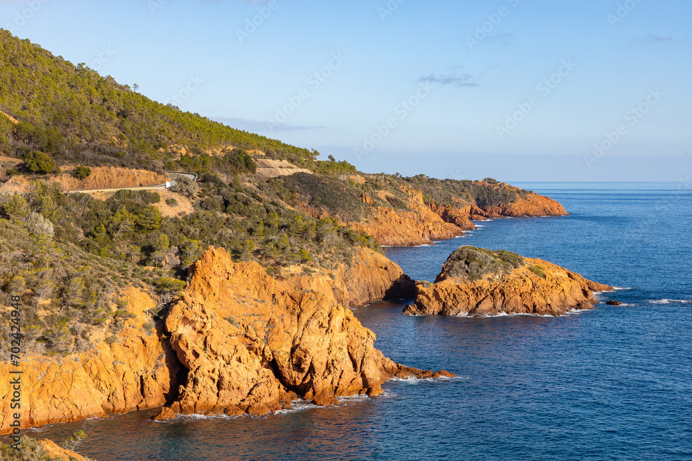 Red and orange volcanic cliffs and hills between Agay and Cannes in the Massif de L'Esterel in France