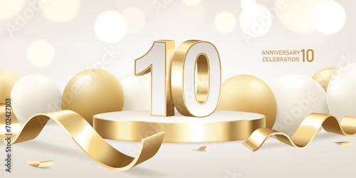 10th Anniversary celebration background. Golden 3D numbers on round podium with golden ribbons and balloons with bokeh lights in background.