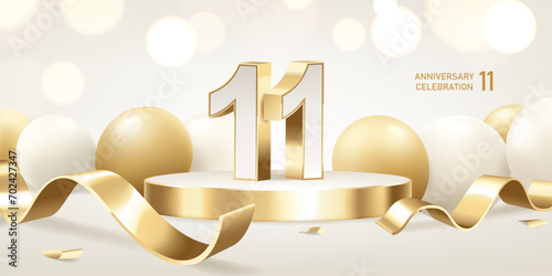 11th Anniversary celebration background. Golden 3D numbers on round podium with golden ribbons and balloons with bokeh lights in background. photo