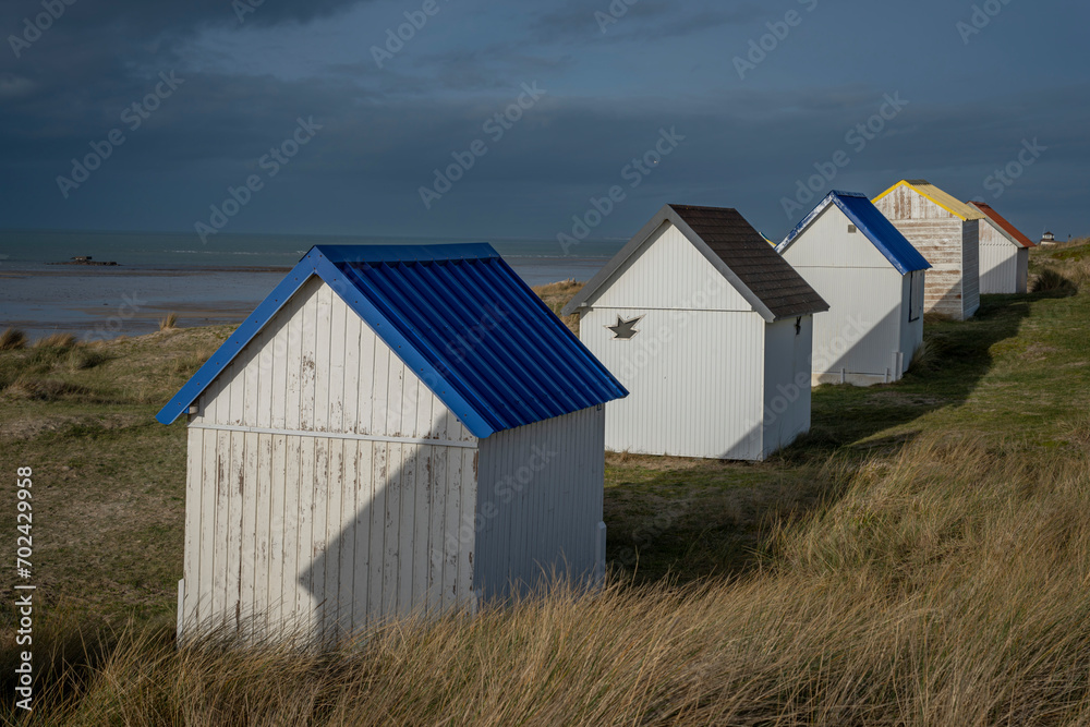 Gouville, France 12 30 2023 View of colorful bathing wooden cabins