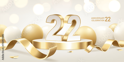 22nd Anniversary celebration background. Golden 3D numbers on round podium with golden ribbons and balloons with bokeh lights in background. photo