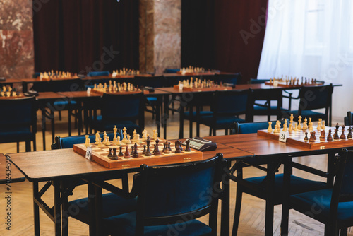 Foto Chess tournament, kids and adults participate in chess match game outdoors in in