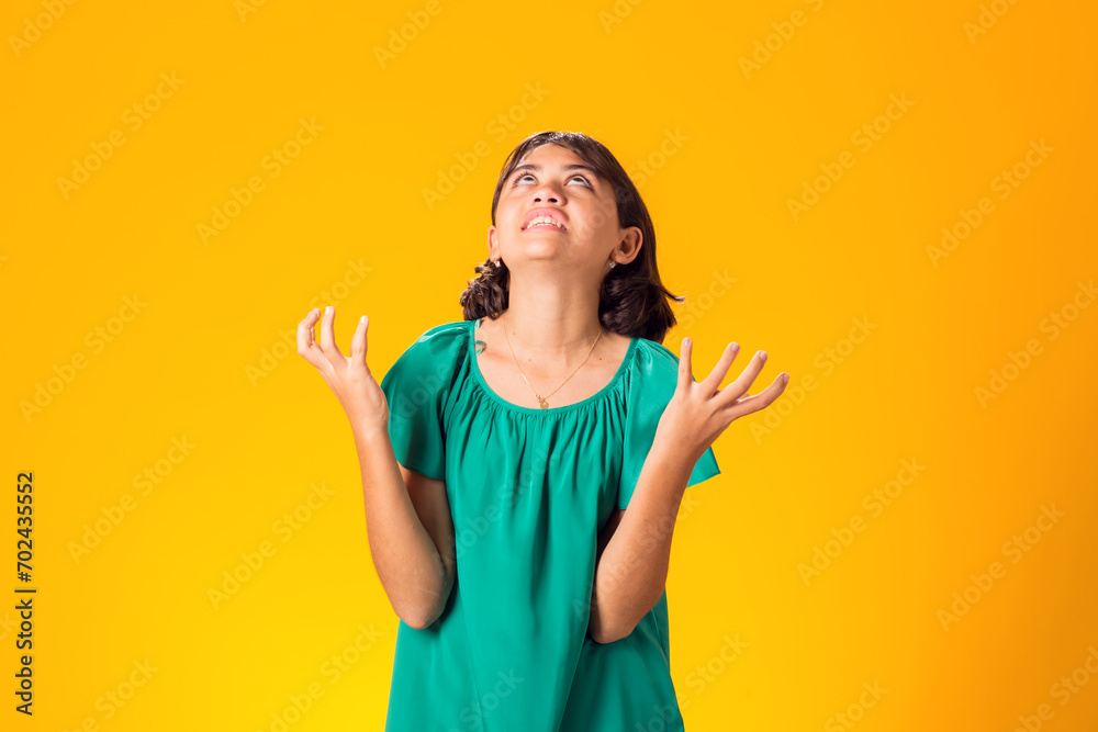 Sad kid girl over yellow background. Frustration concept Sad kid girl over yellow background. Frustration concept