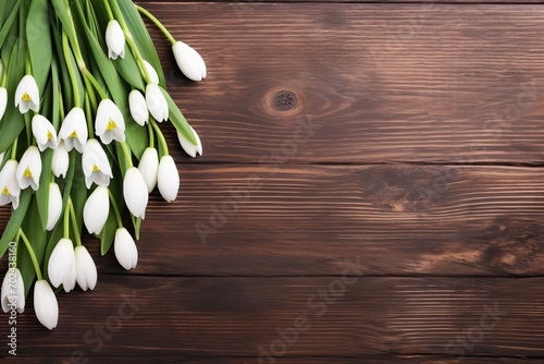 Blooming snowdrop flowers on wooden background