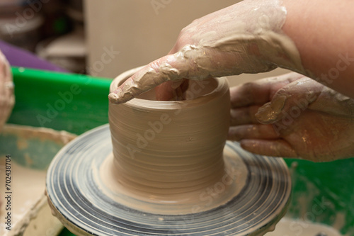 Clay, pottery or hands in designer workshop working on an artistic cup or mug mold in small business studio. Hand of creative artist or worker manufacturing handicraft products in sculpture