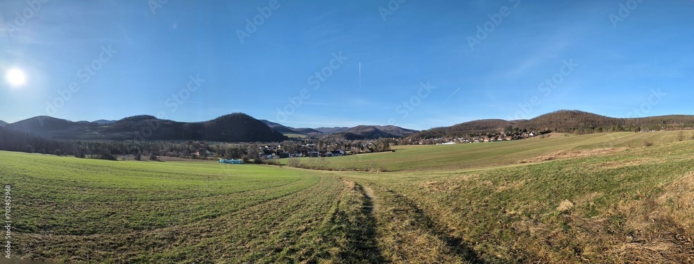 Idyllic landscape with lush green grass and blue sky in Alland, Lower Austria