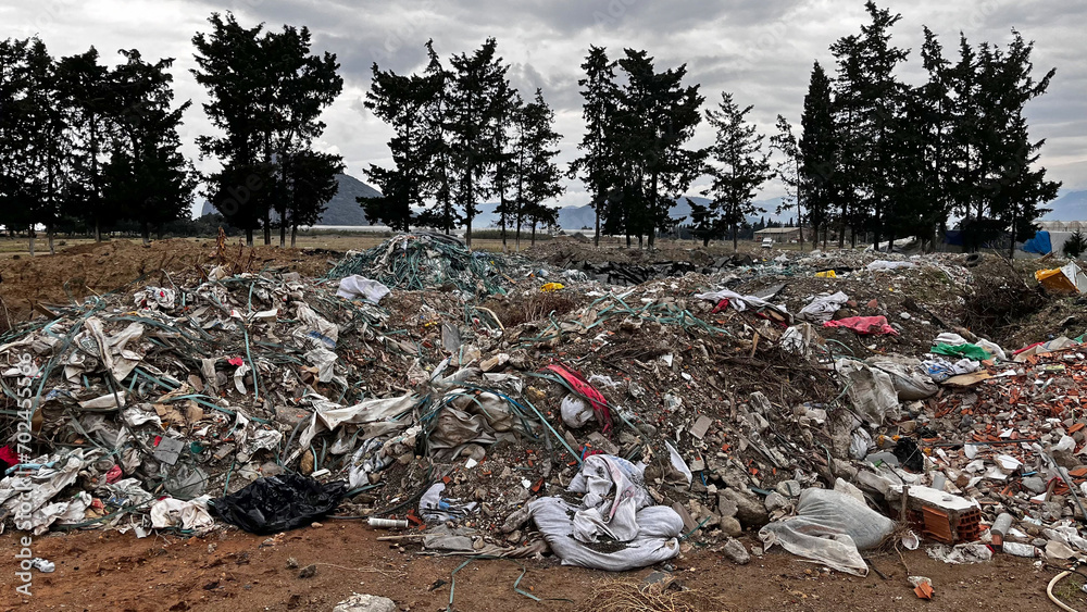 Construction waste dumped in the natural area. Construction waste dumped in the natural area.