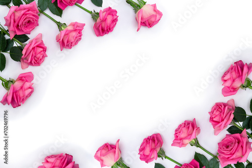 Bouquet of pink flowers roses on a white background with space for text. Top view  flat lay