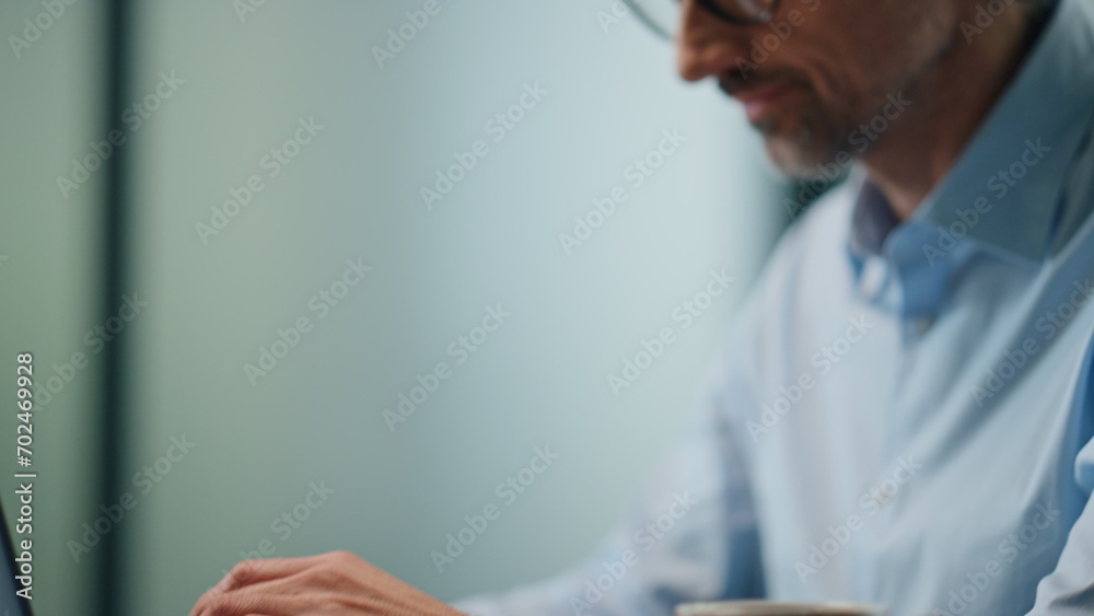 Fototapeta premium Businessman hands working computer keyboard closeup. Man rejoicing achievement