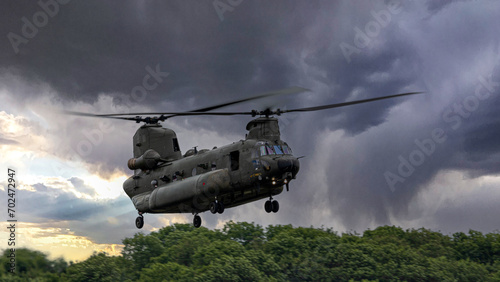 Heavy lift military helicopter in action photo